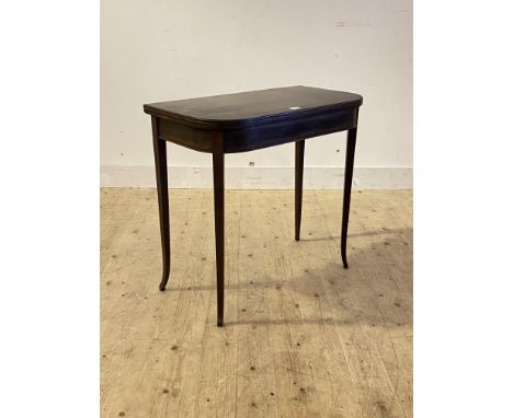 A Late Georgian mahogany fold over card table, the cross banded and boxwood strung top opening and revolving  to reveal a bai