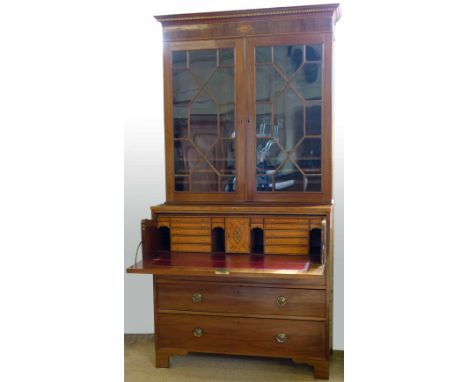 Mahogany secretaire bookcase of astragal glazed doors over a fall front revealing a fitted satinwood interior, on three long 