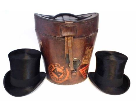 Leather travel hat box, containing two silk top hats, one by A.J. White, the other by Tress and Co. retailed by Smith &amp; S
