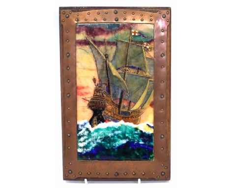 Enamel plaque, decorated with a galleon on rough seas, indistinct monogram to lower left corner, fitted within an arts and cr