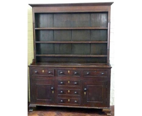 Oak and pine dresser, 19th century, the boarded back over nine drawers and two doors, length 156cm