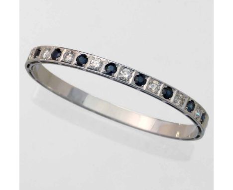 18ct (750) white gold sapphire and diamond hinged bangle, width overall 6cm, gross weight 18.7g