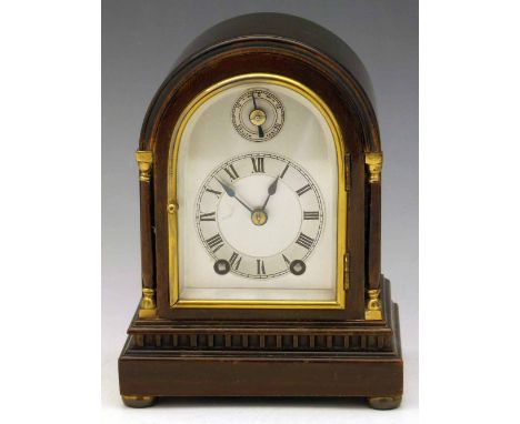 Georgian style small mantel clock, arched silvered dial, eight day balance wheel movement striking the half, in a mahogany ca
