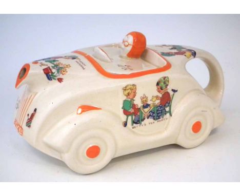 Sadlers OKT42 racing car teapot, printed with nursery prints including 'Wendy Watering', 'Helping Daddy' in the style of Mabe