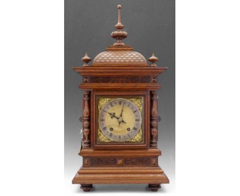 Quarter striking table clock c.1890, the Pagoda top with turned finials side sound fret doors, 7" dial, twin barrel movement 