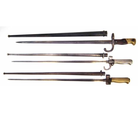 Two French Lebel rifle bayonets with scabbards, also a Gras rifle bayonet dated 1876 and scabbard. (3) overall length in scab