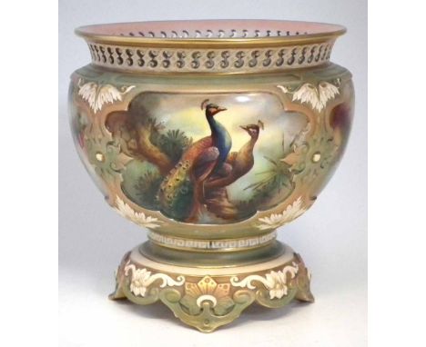 Royal Worcester Hadley's ware jardinière, signed H. Martin, decorated with peacock, with pierced border, moulded body and foo