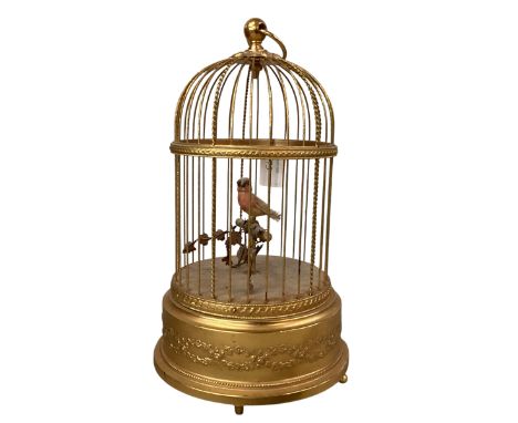 A late C19th gilded bird cage automaton, with wind mechanism to base, and chirping bird. Working at time of viewing. Auctione