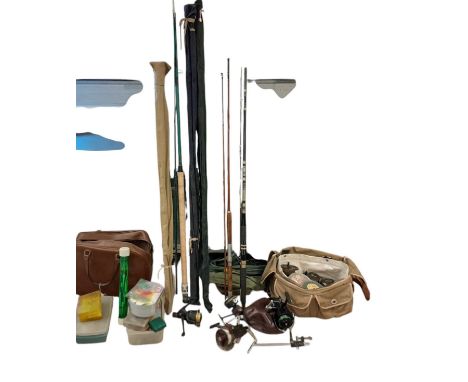 A collection of fishing equipment to include spinning reels, fly fishing reels, lures, hooks, weights, and floats, and fish s
