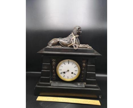 Victorian slate mantle clock with pharoah figural top  with French movement. 