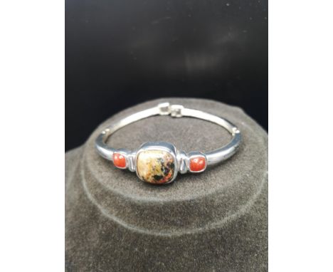 White metal bangle with stone effect marked Monat. 