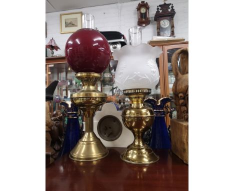 2 brass oil lamp with globe covers etc. 