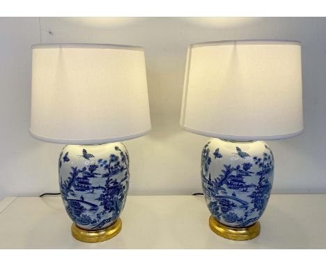 TABLE LAMPS, pair, 62cm H x 38cm diam., Chinese export style blue and white ceramic, neutral shades, with gilt bases (2) 