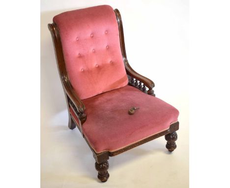 Victorian mahogany framed nursing chair with pink Dralon upholstered seat and button back on turned front legs  