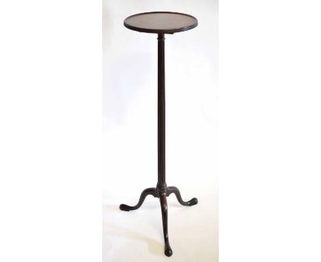 Early 20th century mahogany plant stand with circular top and reeded column on a tripod base, 113cms tall  