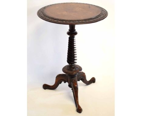 19th century walnut and carved circular wine table with twisted carved column on a carved tripod scrolling base, 57cms diam x