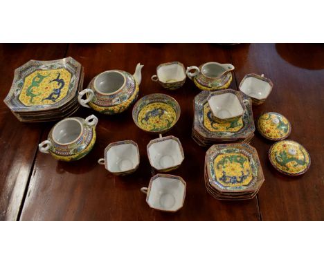 Oriental tea service, the yellow ground body decorated with dragons chasing a flaming pearl comprising lobed plates, side pla