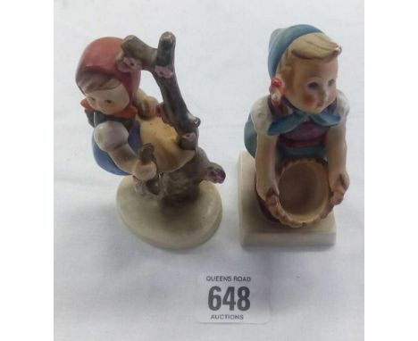 TWO HUMMEL FIGURES OF YOUNG GIRLS - ONE WITH AN EMPTY BASKET THE OTHER SAT IN A TREE