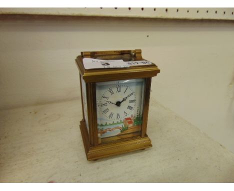 A brass and enamel miniature carriage clock with key