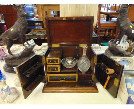 A smokers cabinet with drawers, bowl, pipe and decanter