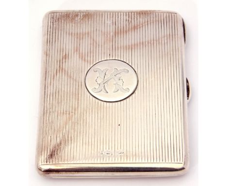 Victorian silver card case of shaped rectangular form with central circular engraved cartouche, and decorated back and front 