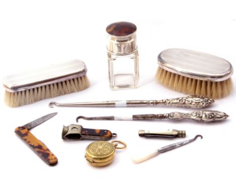 Mixed lot.  two silver small backed dressing-table brushes, engine turned detail, hall marked London 1927, two silver handled