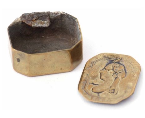 Early 19th century tinned brass pill box of hinged rectangular form with canted corners (hinge a/f), the lid embossed with a 