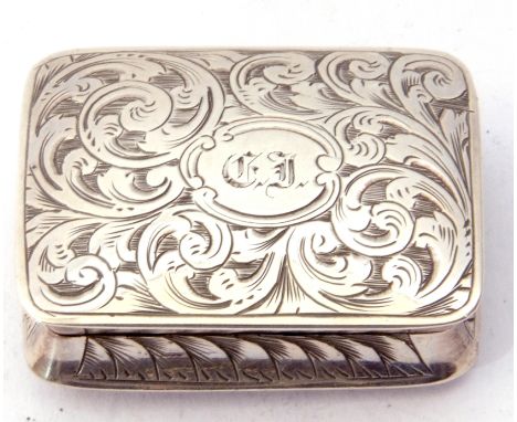 Victorian vinaegrette of rectangular form, elaborately chased and engraved with scrolls, the top with a monogram cartouche, g