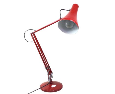 RED ANGLEPOISE STYLE LAMP, on a circular base80cm highOverall this lamp is in good condition, with all joints working well, b