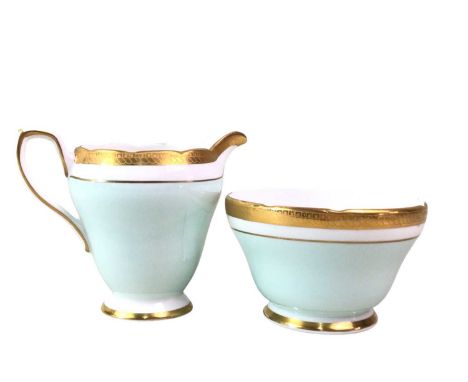 QUEEN ANNE TEA SERVICE, AND A SUTHERLAND TEA SERVICE  each with gilt borders and details on a powder blue ground