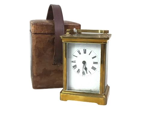 BRASS CARRIAGE CLOCK, with Roman numerals in original leather case12cm highOverall, this clock is in good condition, but in n