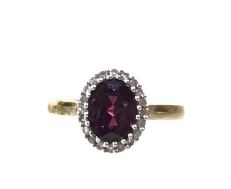 PURPLE GARNET AND DIAMOND DRESS RING, in nine carat gold, size K 1/2Qty: 1.9g