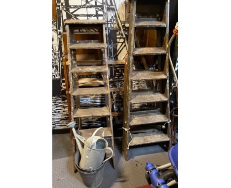 Three pairs of 20th century wooden decorators step ladders, together with a galvanised watering can and two galvanised bucket