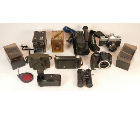 A collection of mixed cameras and accessories to include a video camcorder, a Canon EOS 400D, a Minolta SR-7 and two Brownie 
