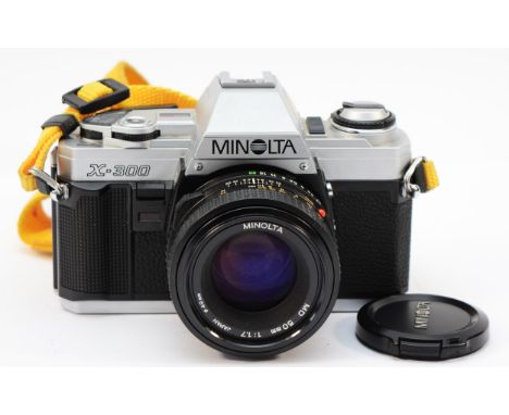 A Minolta X-300 vintage film SLR camera with 50mm lens 