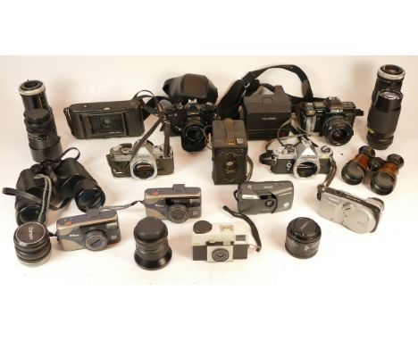 A collection of mixed cameras and accessories to include ten lenses, seven compact film cameras, a Box-Tengor and two vintage