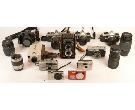 A collection of mixed cameras and accessories to include four lenses, a digital SLR camera, a Hacoflex box camera and four vi