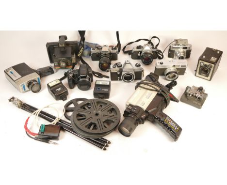 A collection of mixed cameras and accessories to include a Polaroid 10, a Brownie Model C, two digital cameras and four vinta