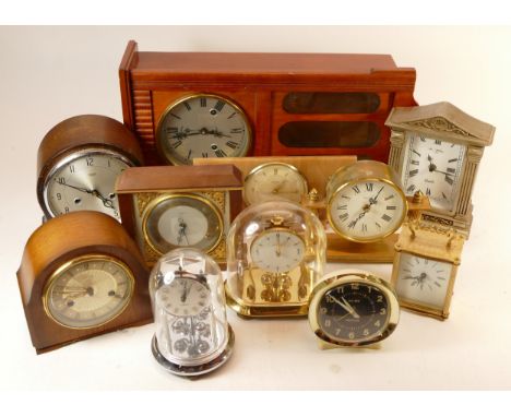 A collection of mid 20th century mantel clocks and barometers, having manual and quartz movements. (3) 