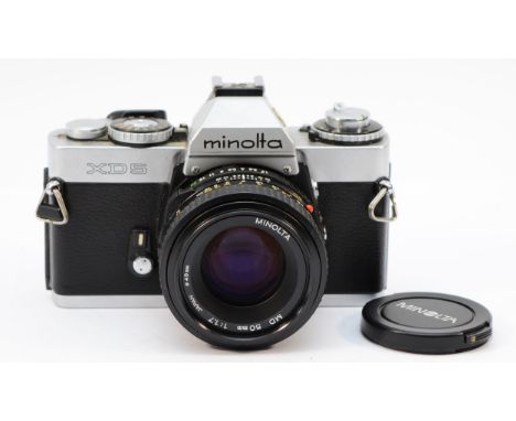 A Minolta XD5 vintage film SLR camera with 50mm lens 
