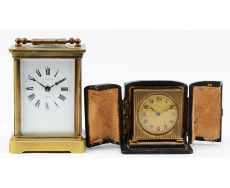 A 20th century French brass carriage clock, the enamelled dial with Roman numerals having 8 day movement, stamped Made In Fra