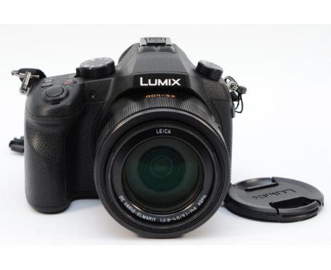 A Panasonic Lumix digital SLR camera with associated lens, serial no FC5KB002108 