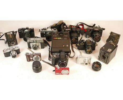 A collection of mixed cameras and accessories to include a Six-20 Brownie, nine digital compact cameras and five vintage film