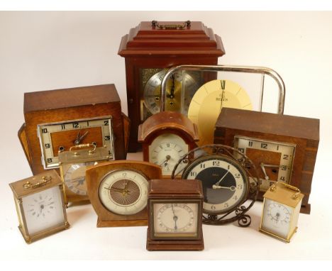 A collection of mid 20th century mantel clocks and barometers, having manual and quartz movements. (3) 