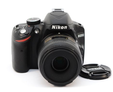A Nikon D3200 digital SLR camera with associated lens, serial no 8063053 