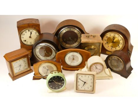 A collection of mid 20th century mantel clocks and barometers, having manual and quartz movements. (3) 