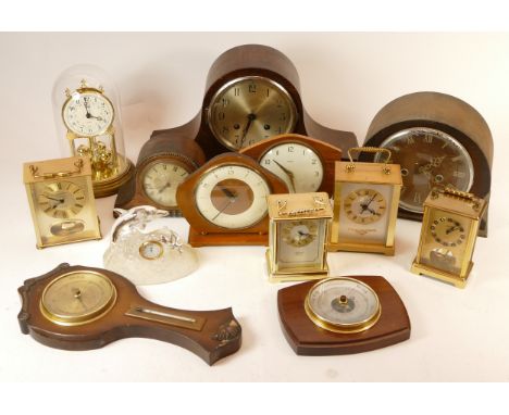 A collection of mid 20th century mantel clocks and barometers, having manual and quartz movements. (3) 