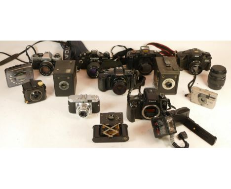 A collection of mixed cameras and accessories to include two box cameras, a polaroid and five vintage film SLR cameras which 