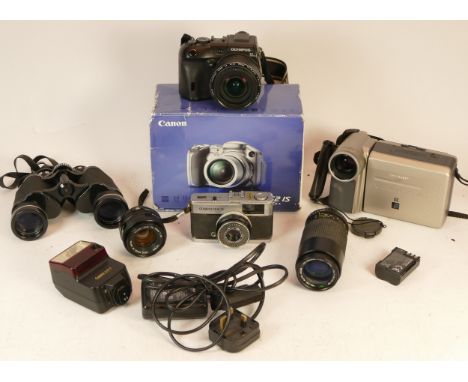 A collection of mixed cameras and accessories to include two digital compact cameras, two lenses, a video camcorder and an Ol