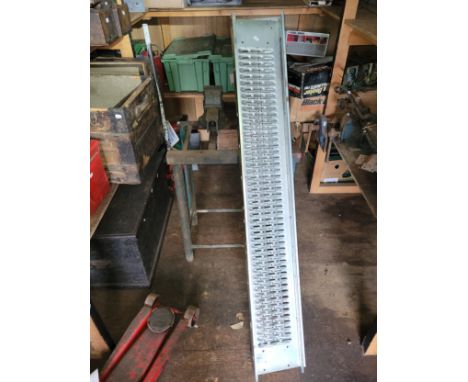 Metal work bench with Paramo vice, also two lengths of metal trunking. 